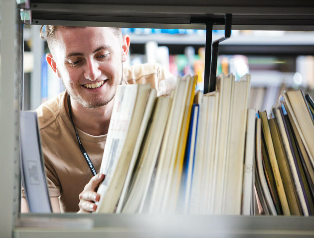 student in library