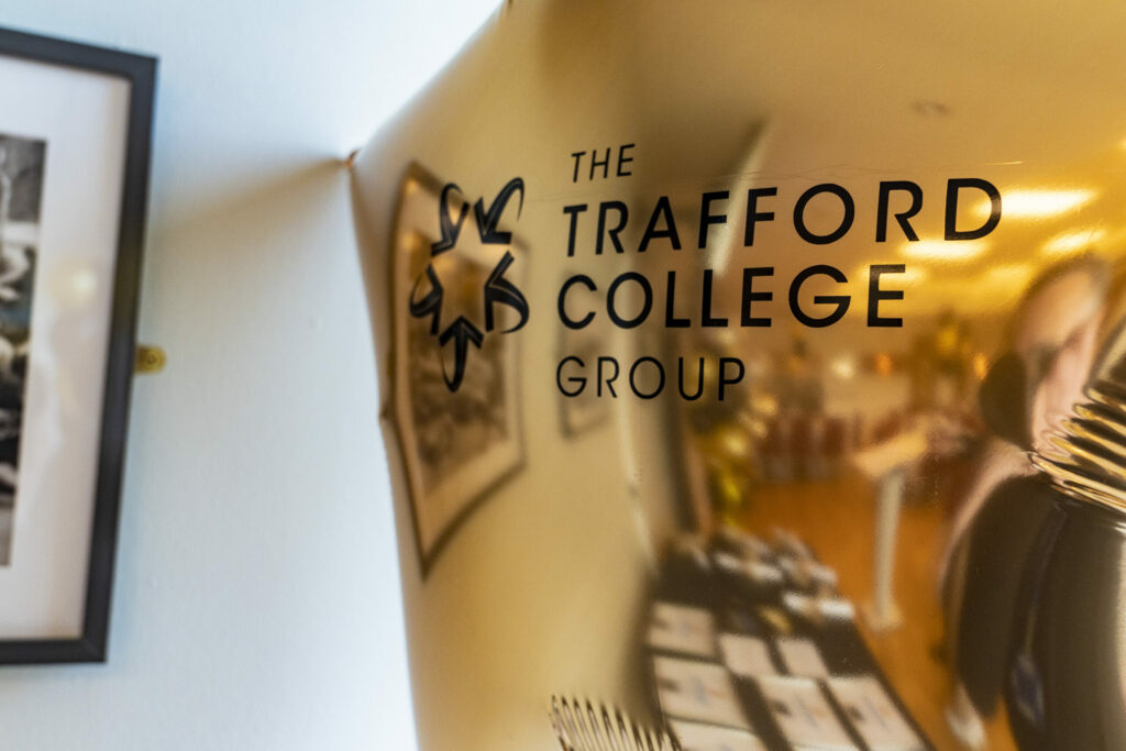 gold star balloon with the TSCG logo