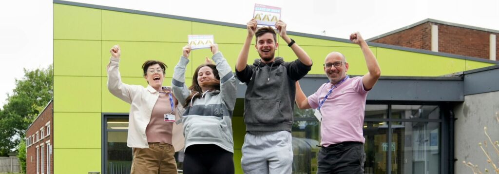 students celebrating their results by jumping in the air