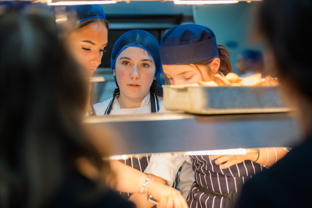 Hospitality students in kitchen